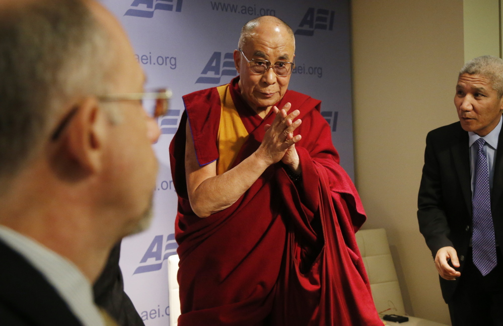 The Dalai Lama leaves after speaking at an event titled “Happiness, Free Enterprise, and Human Flourishing” at the American Enterprise Institute in Washington on Thursday.