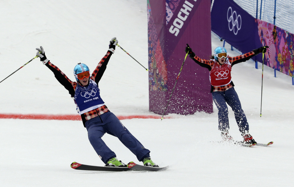 Canada’s Marielle Thompson, left, celebrates winning the gold medal ahead of compatriot Kelsey Serwa in the women’s ski cross final at the 2014 Winter Olympics.