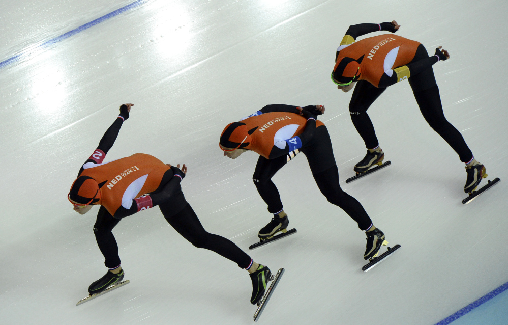 Speedskaters from the Netherlands, left to right, Jorien ter Mors, Ireen Wust, and Lotte van Beek compete in the women’s speedskating team pursuit quarterfinals at the Adler Arena Skating Center at the 2014 Winter Olympics, Friday, Feb. 21, 2014, in Sochi, Russia. (AP Photo/Antonin Thuillier, Pool)