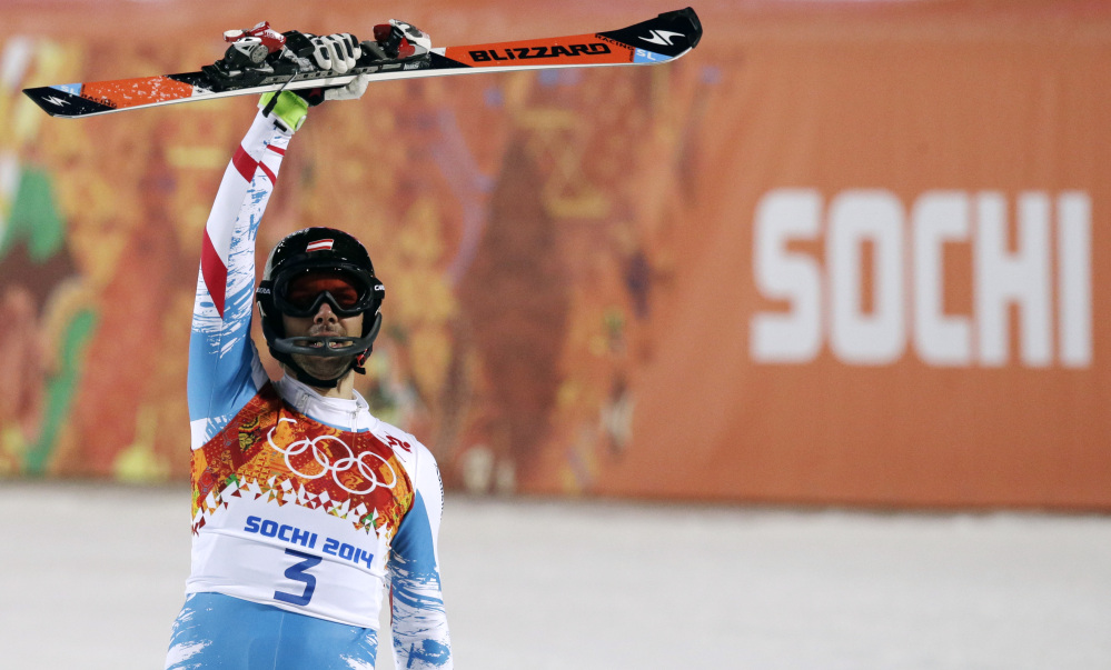 Austria’s Mario Matt celebrates winning the gold medal in the men’s slalom Saturday at the Sochi 2014 Winter Olympics in Krasnaya Polyana, Russia.