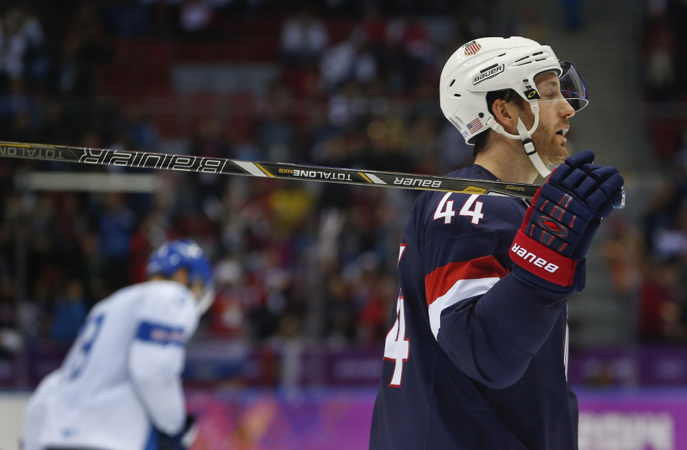 USA defenseman Brooks Orpik reacts after a goal by Finland during the third period of the men’s bronze-medal hockey game Saturday at the 2014 Winter Olympics in Sochi, Russia.Finland won, 5-0.
