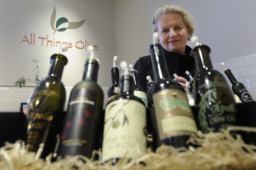 Patricia Darragh, executive director of the California Olive Oil Council, shows off a collection of California olive oil. In another decade or two, Americans may be more familiar with the domestic variety. “We’re where the California wine industry was 20 or 30 years ago,” she says.