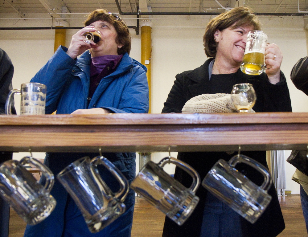 Nancy Coleman of Portland and Janice DiBona of Biddeford Pool sample brews Saturday in the Banded Horn Brewing Co. tasting room. Banded Horn Brewing just opened last year.
