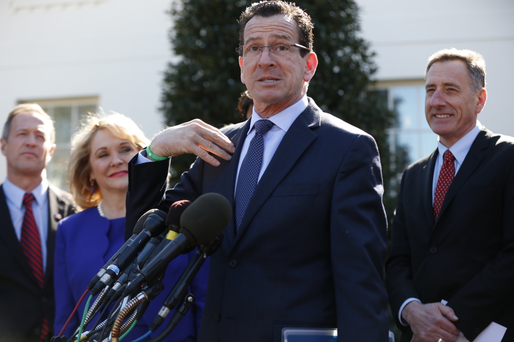 Connecticut Gov. Dannel Malloy, center, speaks to reporters outside the White House in Washington on Monday following a meeting between President Barack Obama and members of the National Governors Association. From left are, Maryland Gov. Martin O’Malley, Oklahoma Gov. Mary Fallin, Malloy, and Vermont Gov. Peter Shumlin.