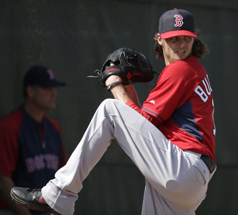 Clay Buchholz, seen during a spring training session at Fort Myers, Fla., is hoping to log a full, healthy season after an injury put a halt on his sparkling 9-0 start for Boston in 2013.