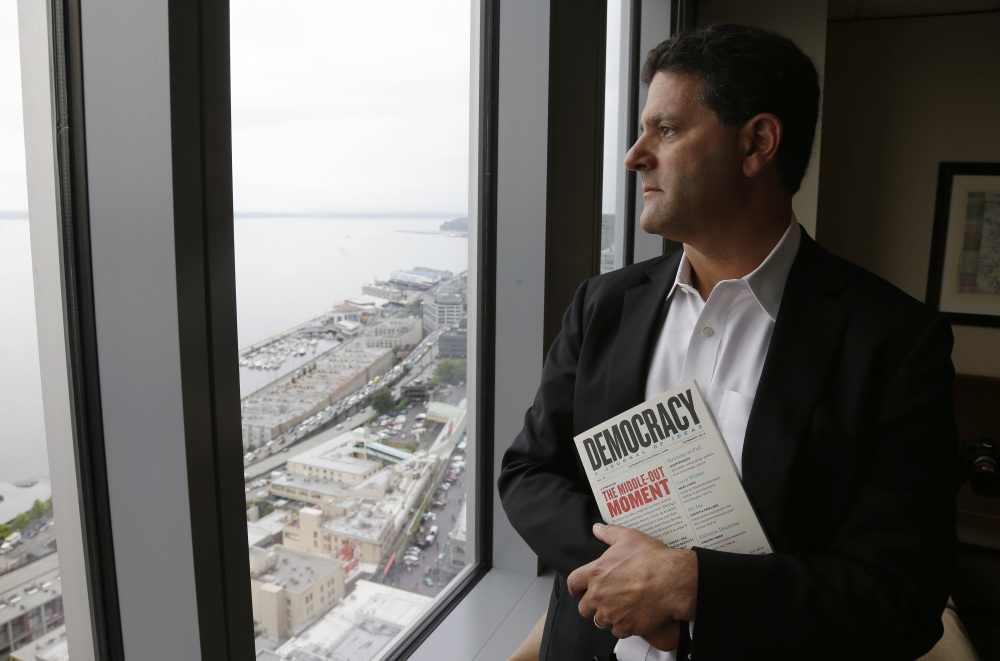 Venture capitalist Nick Hanauer holds a copy of “Democracy: A Journal of Ideas,” which includes an article he co-authored promoting an economy driven by a strong middle class.