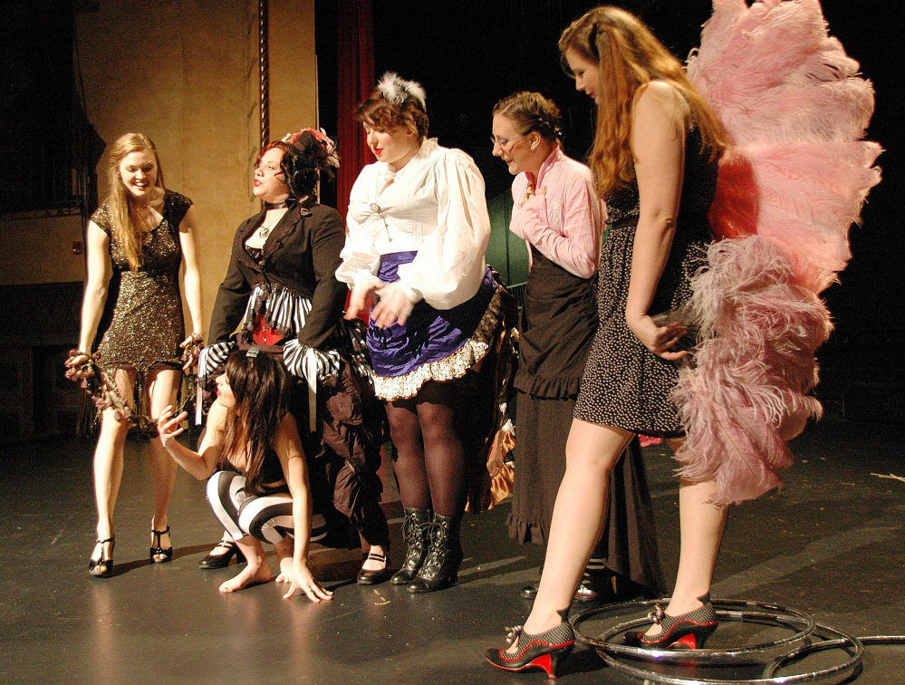 Members of the Pink Box Burlesque troupe gather on stage at the Bama Theatre in Tuscaloosa, Ala. The group, now in its seventh season, is part of a rebirth of the art of burlesque in recent years.