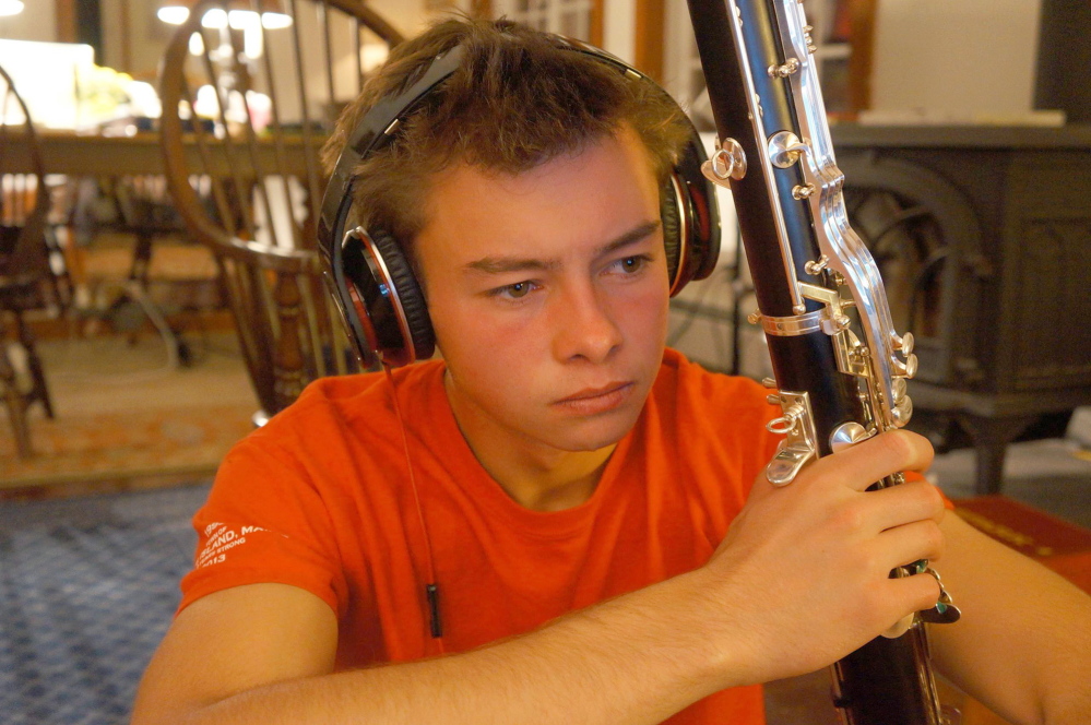 Benjamin Edward LaMontagne holds his bass clarinet, an uncommon instrument to take up early in life. He also played trumpet, bassoon, saxophone and English concertina.