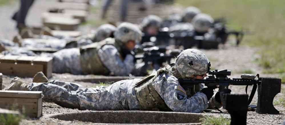 Female soldiers train on a firing range in Fort Campbell, Ky. Combat jobs are newly opening for women in the Army.