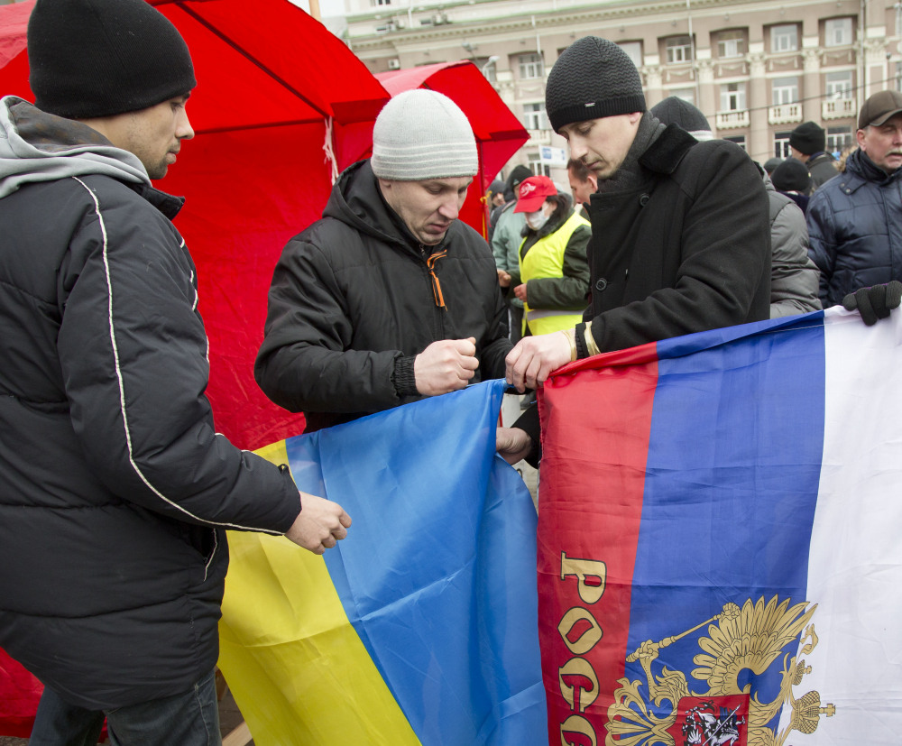 Ukrainian and Russian flags are displayed in Donetsk, eastern Ukraine, on Tuesday.