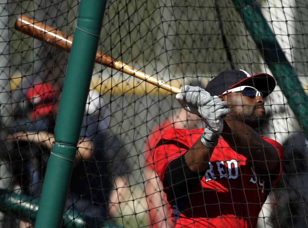 Boston Red Sox center fielder Jackie Bradley Jr. follows through on a swing at batting practice during spring training baseball practice this month in Fort Myers, Fla.