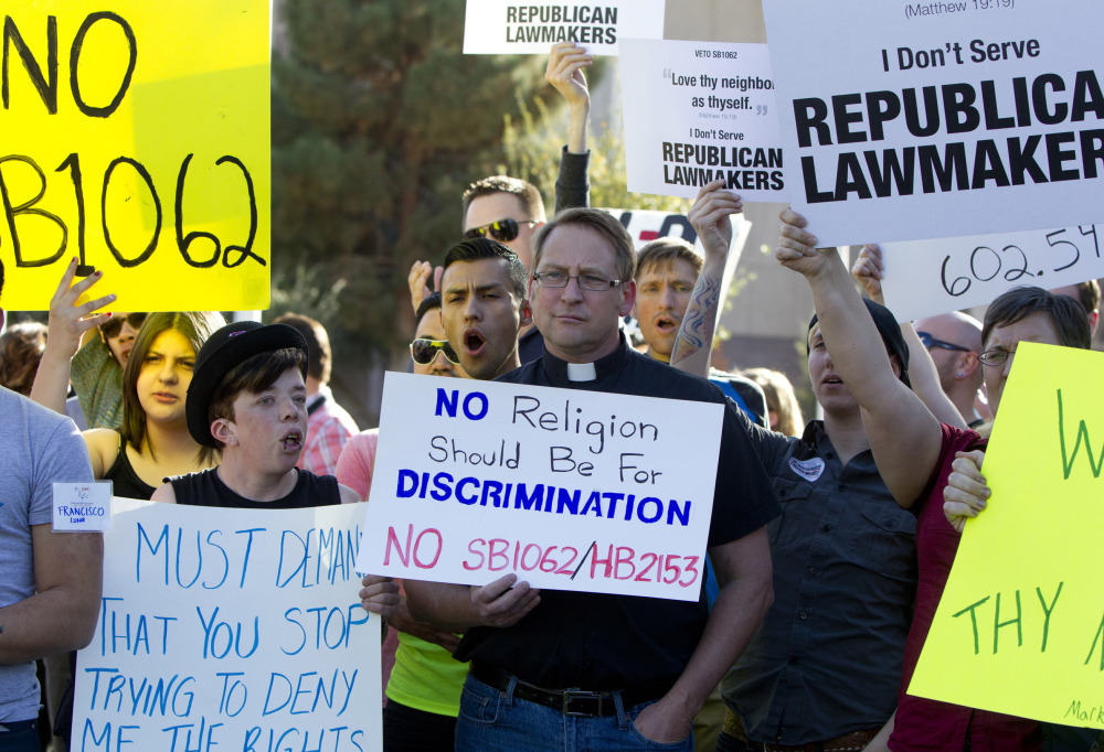 Opponents of Senate Bill 1062 rally for its veto last week at Arizona’s Capitol. The bill, presented as a protection for religious freedom, was vetoed for its discrimination potential.
