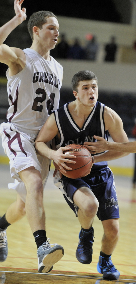 Caleb Martin, driving between two Greely players in the Western Class B final, made the varsity as a freshman at Poland and now, in his senior season, has become a go-to player for a team that will play for the state championship Friday night at Bangor.