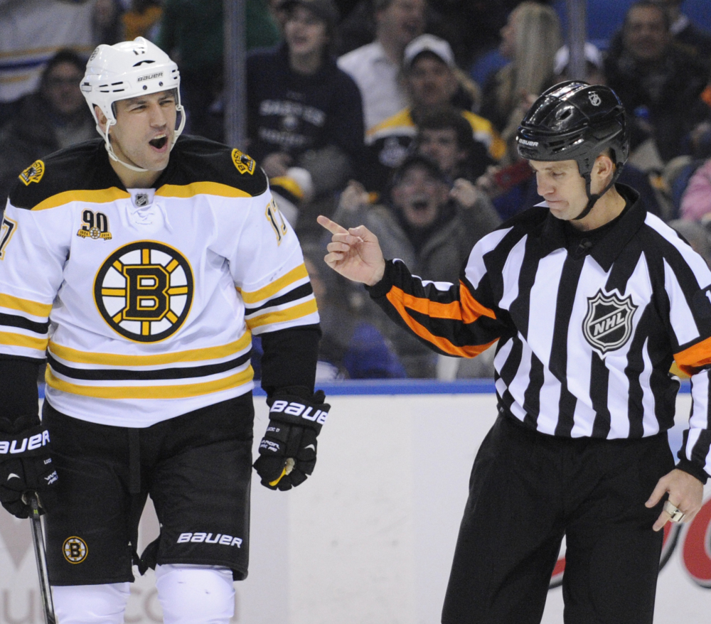 Milan Lucic of the Boston Bruins reacts to a boarding call by referee Brian Pochmara during the second period of a 5-4 overtime loss Wednesday at Buffalo.