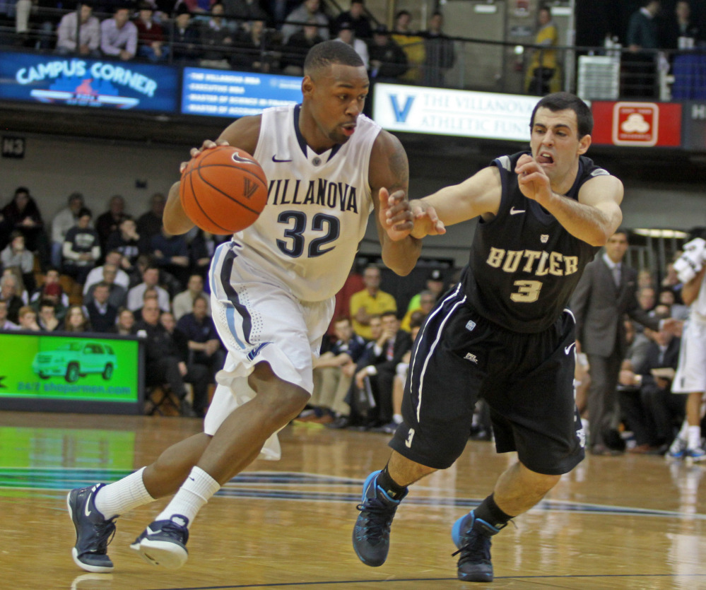 Butler’s Alex Barlow defends as Villanova’s James Bell drives into the lane during the first half of Villanova’s 67-48 win at home on Wednesday night.