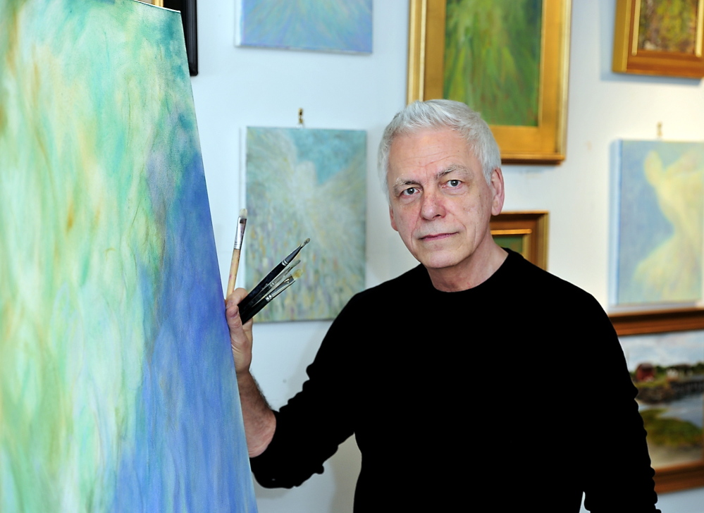 Paul Noel in his studio in Wells with some of the paintings that will be in his show at Whitney Galleries in Ogunquit.