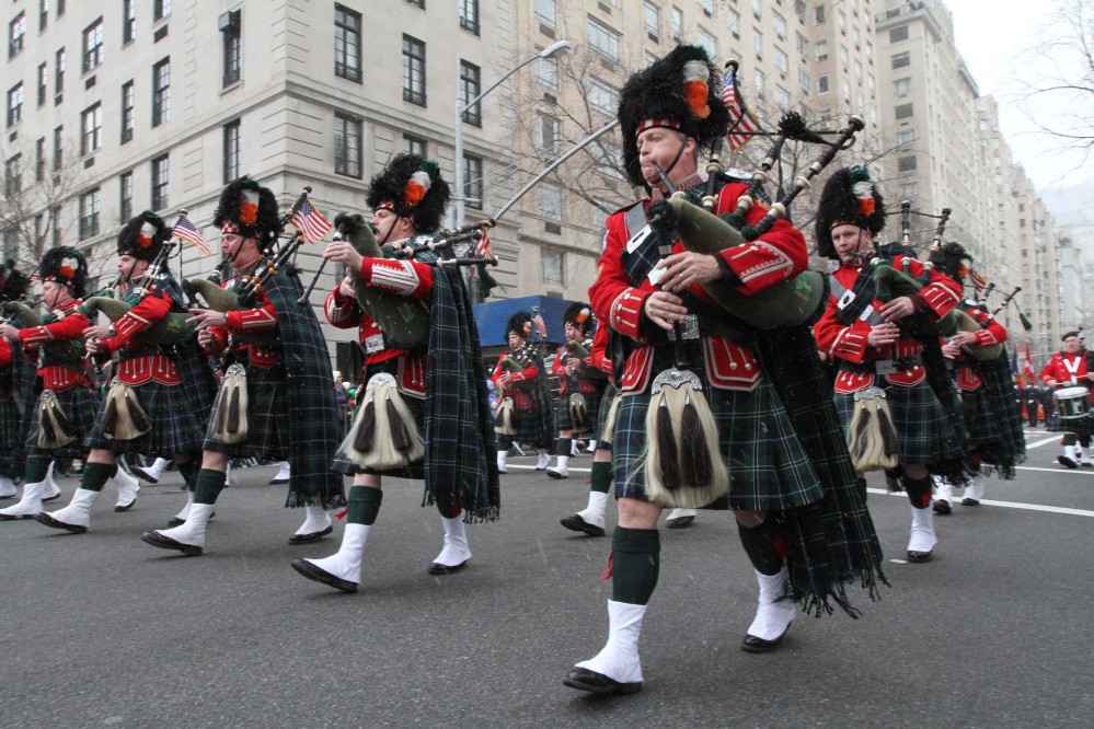 Members of the New York City Fire Department’s Emerald Society Pipes and Drums make their way up New York’s Fifth Avenue as they take part in the 2013 St. Patrick’s Day Parade.