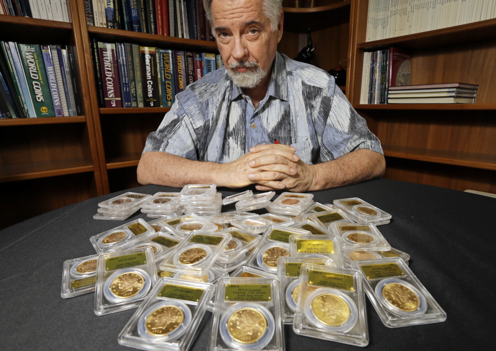 In his office in Santa Ana, Calif., David Hall, co-founder of Professional Coin Grading Service, displays some of U.S. gold coins that were found by a Northern California couple. Dating from the Gold Rush era, the coins are in mint condition.