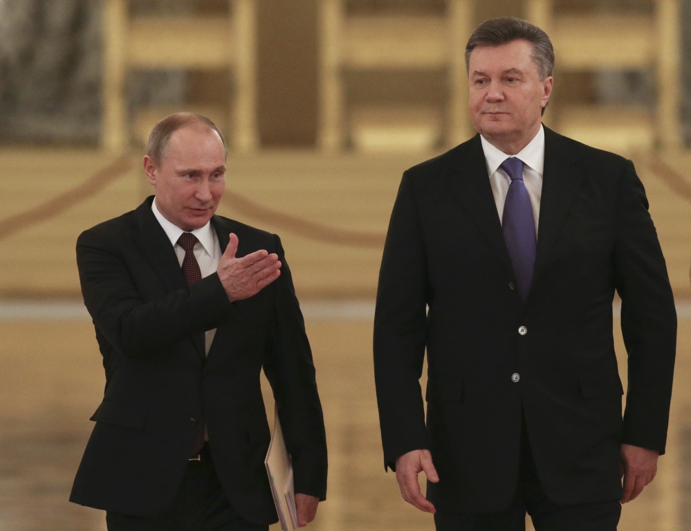 Russian President Vladimir Putin, left, appears with his Ukrainian counterpart Viktor Yanukovych during a Dec. 17, 2013, meeting in the Kremlin.