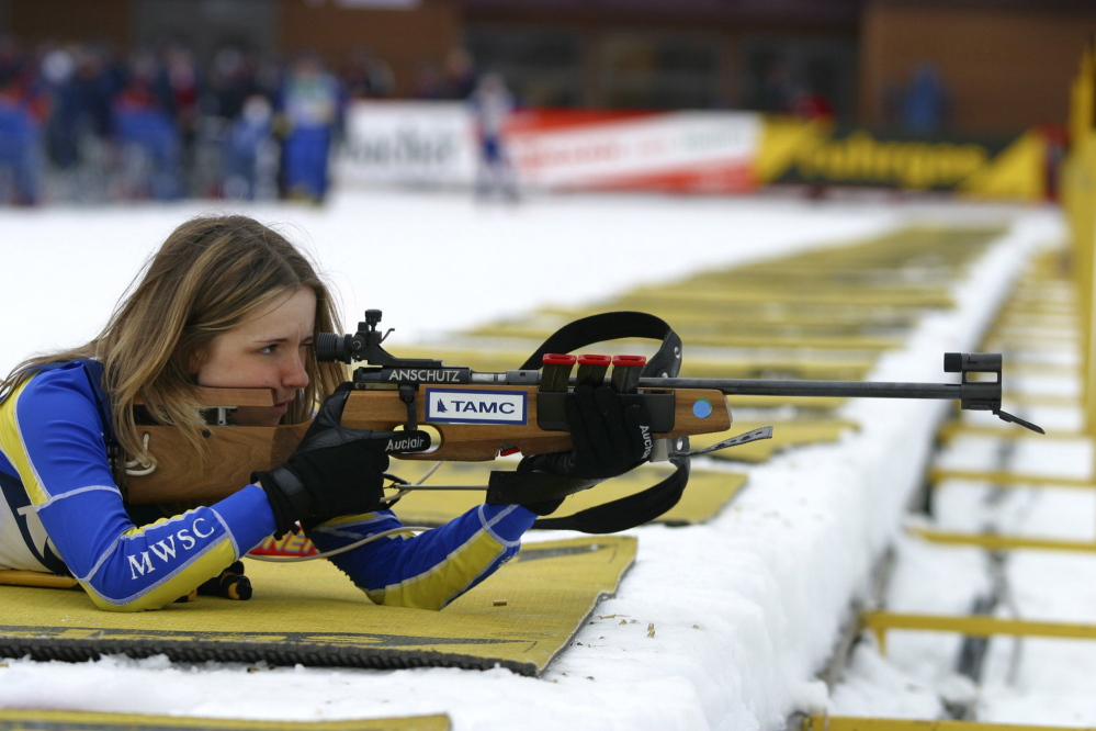 Wearing her Maine Winter Sports Center jersey, Meagan Toussaint of Madawaska takes aim in a biathlon competition. A Presque Isle native has given the center $100,000 and an additional matching grant of $400,000.