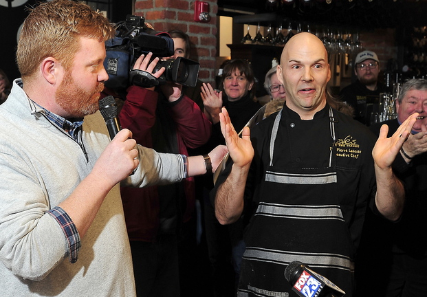 Event organizer Jim Britt, left, announces the winner of Friday’s breakfast cook-off: chef Tim Labonte from Eve’s at the Garden, Portland Harbor Hotel, who won in his first year of competing.