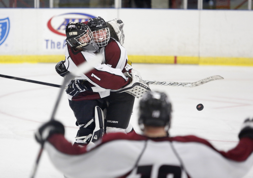Justin Broy, left, and Dylan Turner of Gorham celebrate after defeating Kennebunk, Friday, Feb. 28, 2014, in the Class B West semifinal game at the Colisee in Lewiston.