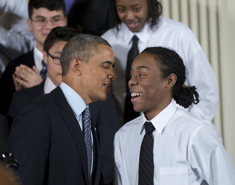President Barack Obama speaks with Christian Champagne, 18, a senior at Hyde Park Career Academy in Chicago, on Thursday before launching an initiative to provide greater opportunities for young black and Hispanic men called "My Brother's Keeper."