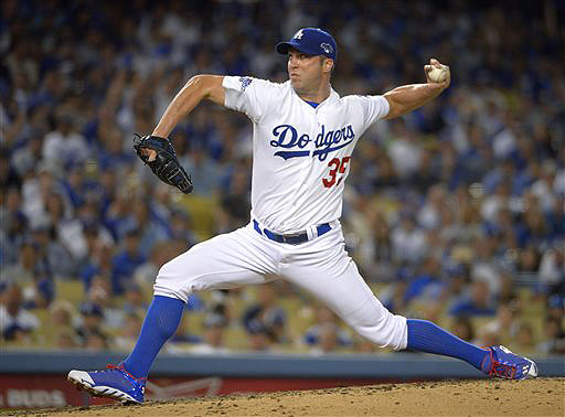 Chris Capuano, shown pitching for the Los Angeles Dodgers, worked out with the Boston Red Sox on Saturday after signing a $2.25 million, one-year contract.