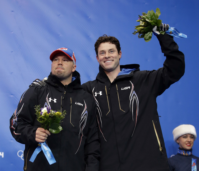 The team from the United States USA-1, piloted by Steven Holcomb and brakeman Steven Langton, celebrate their bronze medal win after the men's two-man bobsled competition at the 2014 Winter Olympics on Monday in Krasnaya Polyana, Russia. 2014 Sochi Olympic Games;Winter Olympic games;Olympic games;Sports;Events;XXII Olympic Winter Games
