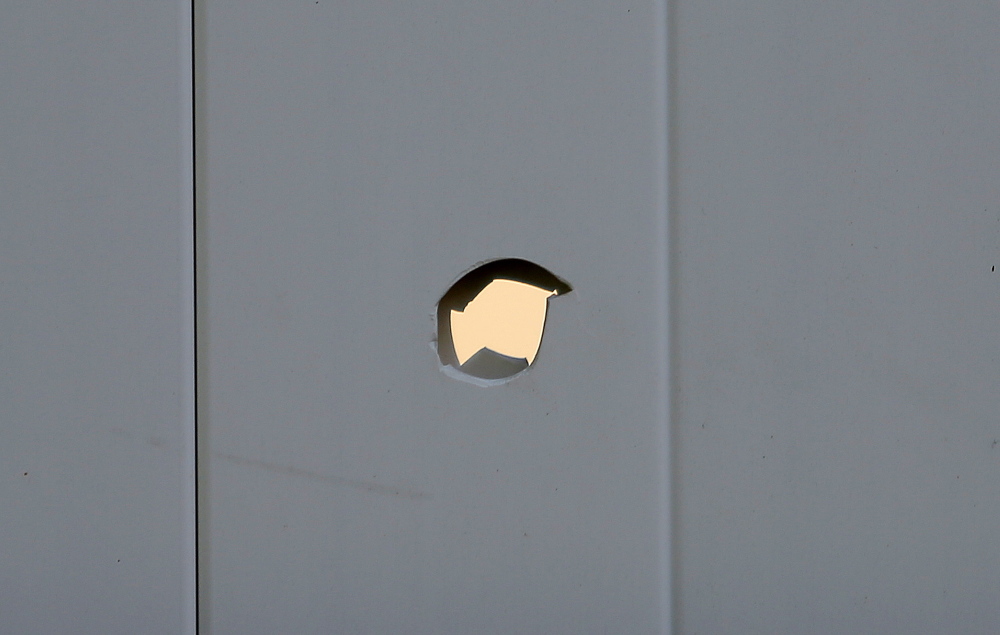 A bullethole in Toni Macquinn’s backyard fence in Old Orchard Beach.
