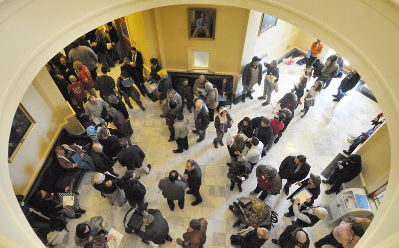 The third-floor hallway between House and Senate chambers is crowded with people attending a rally held to support Medicaid expansion on the first day of this year's legislative session on Jan. 8 at the State House in Augusta.