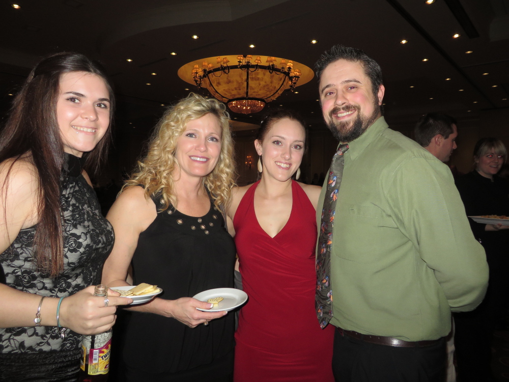 Makyla Hamlin, office manager at TLC Realty in Windham, Tammy Caron, owner of TLC Realty, and Andrea and Benjamin O’Brion of Prospect Mortgage in South Portland.