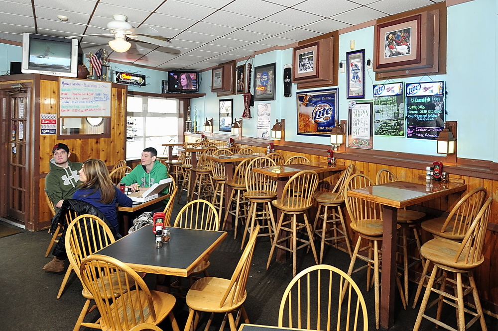Barbara Bushey enjoys lunch with sons Billy, left, and Zach at Samuel’s Bar & Grill at Morrill’s Corner in Portland.