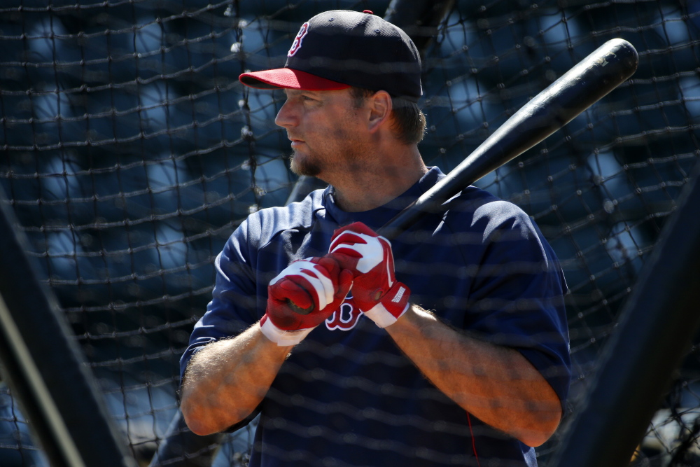 Boston Red Sox's A.J. Pierzynski takes his turn in the batting cage before an exhibition spring training baseball game against the Pittsburgh Pirates in Bradenton, Fla., Monday, March 3, 2014. (AP Photo/Gene J. Puskar)