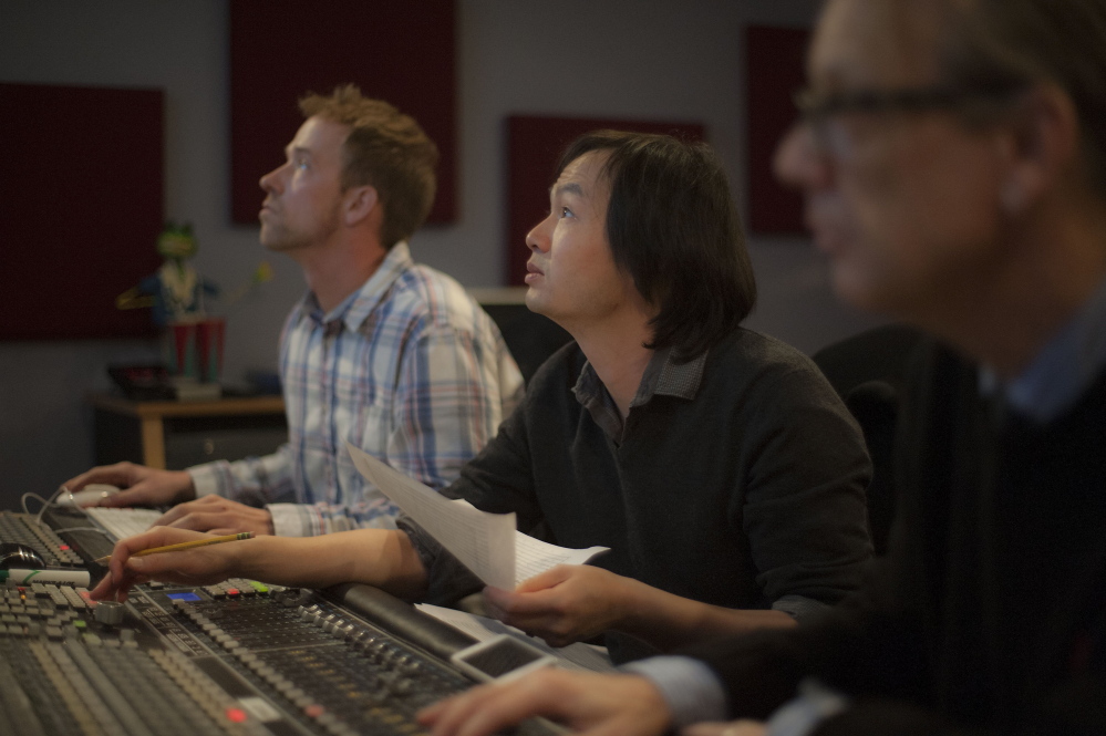 Grammy-winning composer Christopher Tin monitors the audio recording of Anonymous 4 at a New England School of Communications studio.