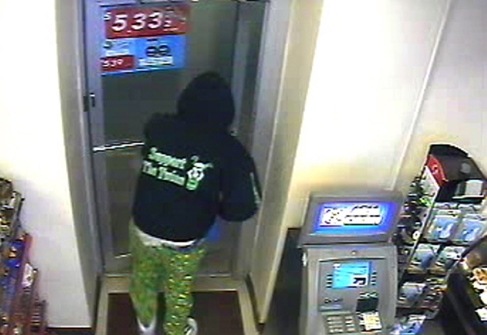 A security camera photo shows the “Support the Twins” lettering on the back of the robber’s hooded sweatshirt.