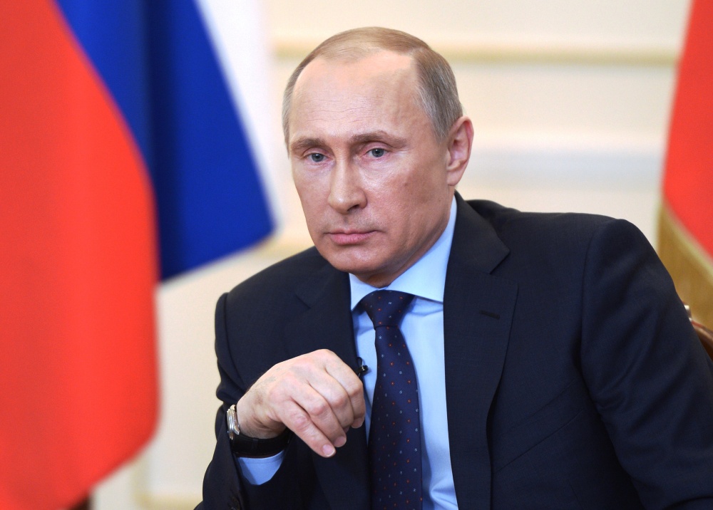 Russian President Vladimir Putin listens to journalists’ questions on the current situation in Ukraine outside Moscow on Tuesday. It would be a risky proposition for him to cut off natural gas supplies to Ukraine.