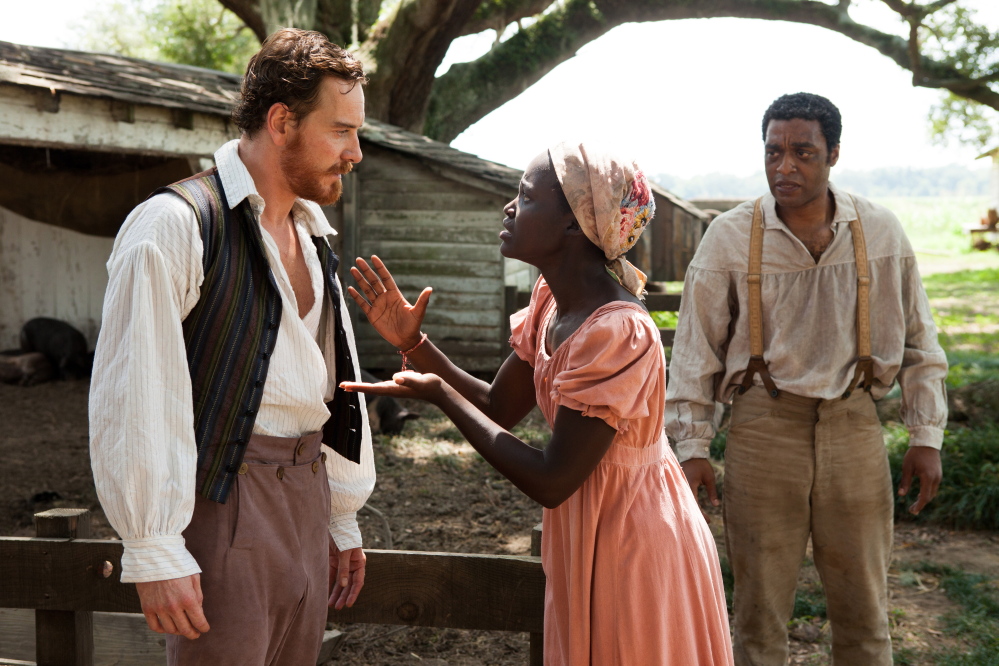 Michael Fassbender, Lupita Nyong’o and Chiwetel Ejiofor, right, in “12 Years a Slave.”