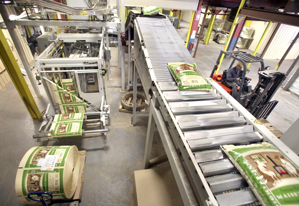 Forty-pound bags of Maine’s Choice Premium Wood Pellets move along a conveyor belt at the operating plant of Geneva Wood Fuels in Strong. Demand for wood pellets this winter has been high.
