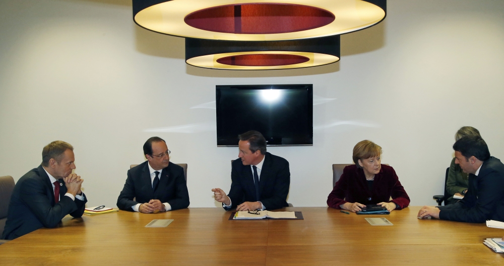 From left, Polish Prime Minister Donald Tusk, French President Francois Hollande, British Prime Minister David Cameron, German Chancellor Angela Merkel and Italian Prime Minister Matteo Renzi speak with each other during a meeting at an EU summit in Brussels on Thursday, March 6, 2014. EU heads of state meet Thursday in emergency session to discuss the situation in Ukraine.