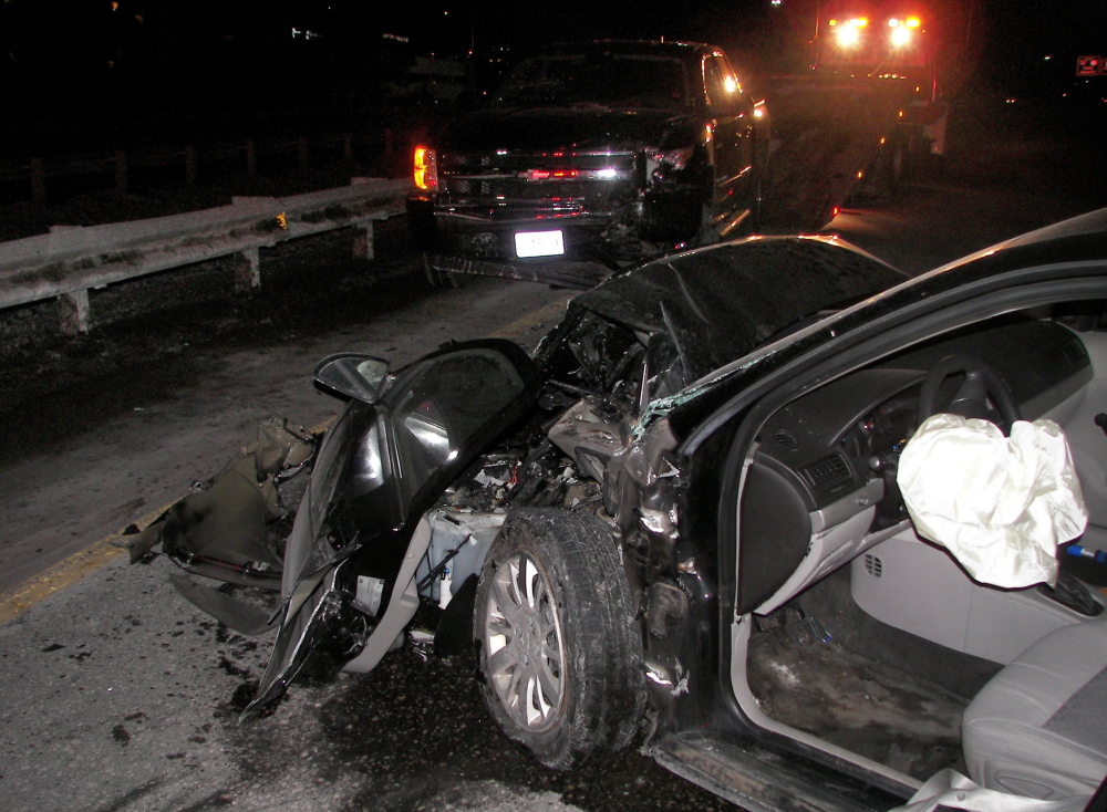 This photo provided by police shows the damage done to a Chevrolet Cobalt after a collision on I-295 Wednesday night with an alleged wrong-way driver. The Cobalt’s driver, Amy Turner, was in fair condition at Maine Medical Center Friday.