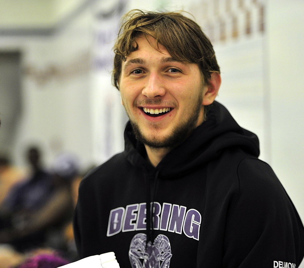 Eric Delmonte of Deering set a state record in the 100-yard breast stroke and also won the 200 individual medley at the Class A state championships.