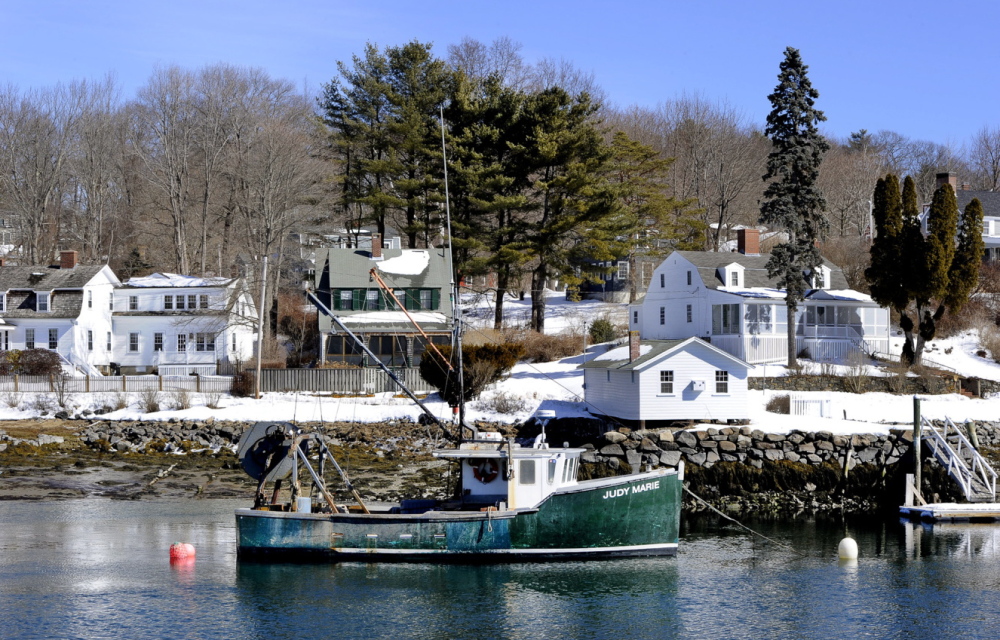 A lobster boat floats in the York River, which is used by commercial and recreational fishermen. The river flows from York Pond past farm fields and salt marshes to York Harbor, touching York, Kittery, South Berwick and Eliot.