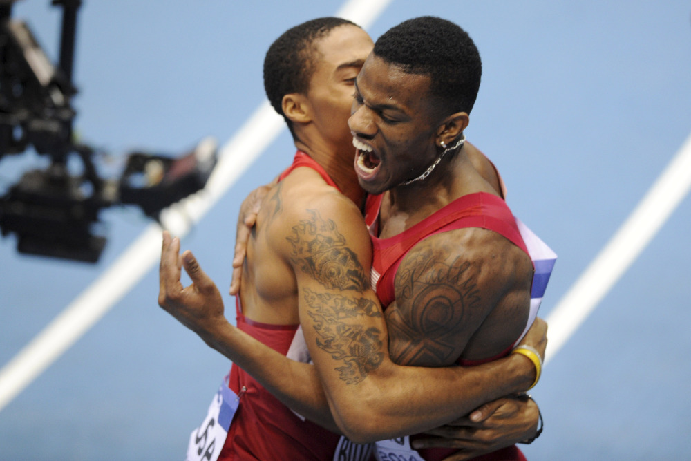 United States’ Kyle Clemons, right, and Kind Butler III celebrate winning the gold and setting an indoor world record in the men’s 4x400m relay final during the Athletics Indoor World Championships in Sopot, Poland on Sunday.