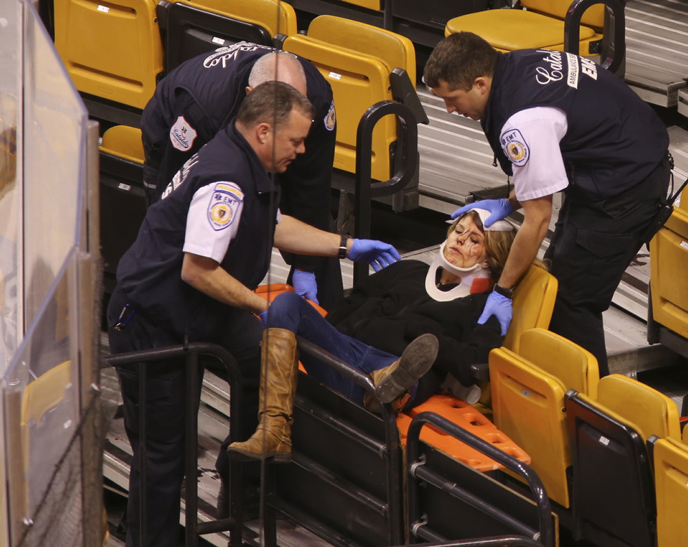 Emergency workers attend to Scarborough's Sabina Grasso after she was injured by a metal pole at TD Garden.