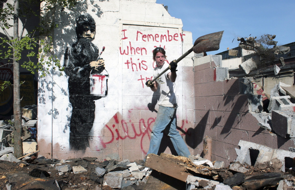 Graffiti art created by Banksy, shown in 2010 in its original location at an abandoned Detroit car plant, will be sold, say officials of 555 Nonprofit Gallery and Studios.