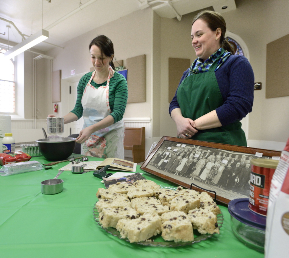 Sisters Kim Kelley Frost and Stephanie Kelley sift the flour for their version of Irish soda bread, which they eat every St. Patrick’s Day in memory of their late grandmother, Helen Kelley.