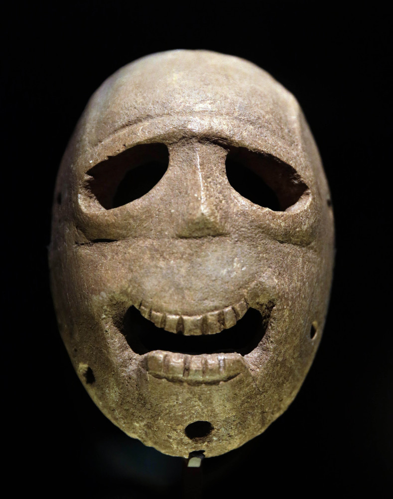 A 9,000-year-old mask is on display at the Israel Museum in Jerusalem.