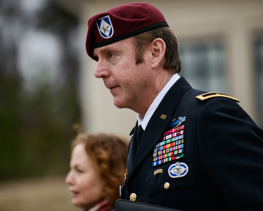 Brig. Gen. Jeffrey Sinclair leaves the courthouse at Fort Bragg, N.C., in this March 4, 2014, photo. He has admitted to having an affair with a female subordinate but has denied assaulting her.