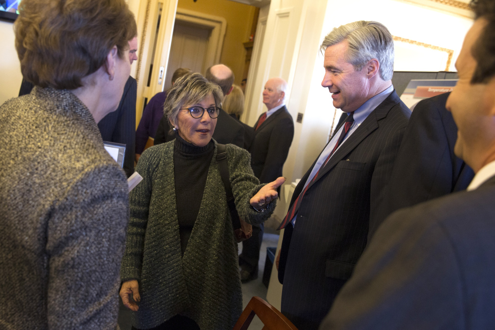 Senate Environment and Public Works Committee Chairman Sen. Barbara Boxer, D-Calif. talks with Senators during a meeting of the Senate Climate Action Task Force prior to taking to the Senate Floor all night to urge action on climate change on Capitol Hill on Monday, March 10, 2014, in Washington. From left, Sen. Jeanne Shaheen, D-N.H, Boxer, Sen. Sheldon Whitehouse, D-R.I., and Sen. Brian Schatz, D-Hawaii.
